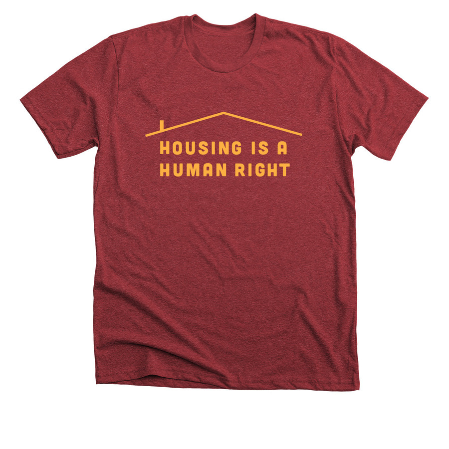 Red t-shirt with yellow text saying housing is a human right