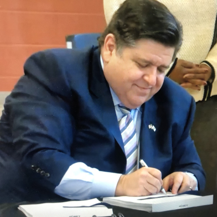 Governor Pritzker signing legislation